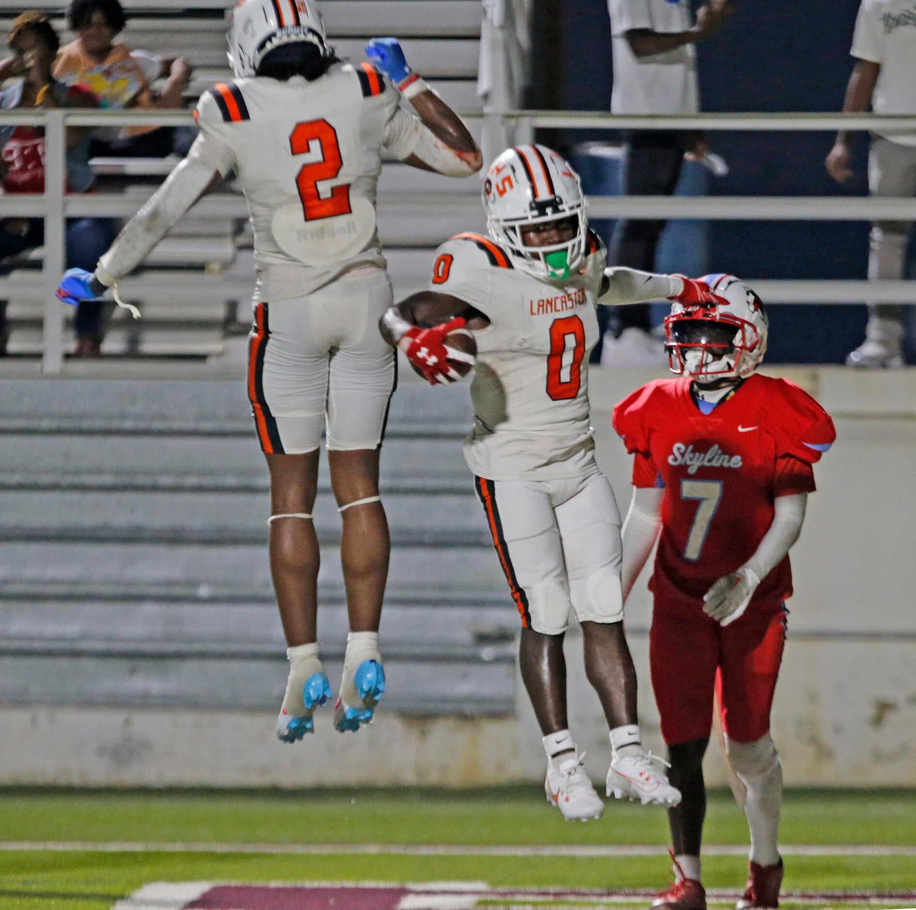 Lancaster High’s’Ti’Erick Martin (0) celebrates his touchdown with teammate Kewan Lacy (2)...