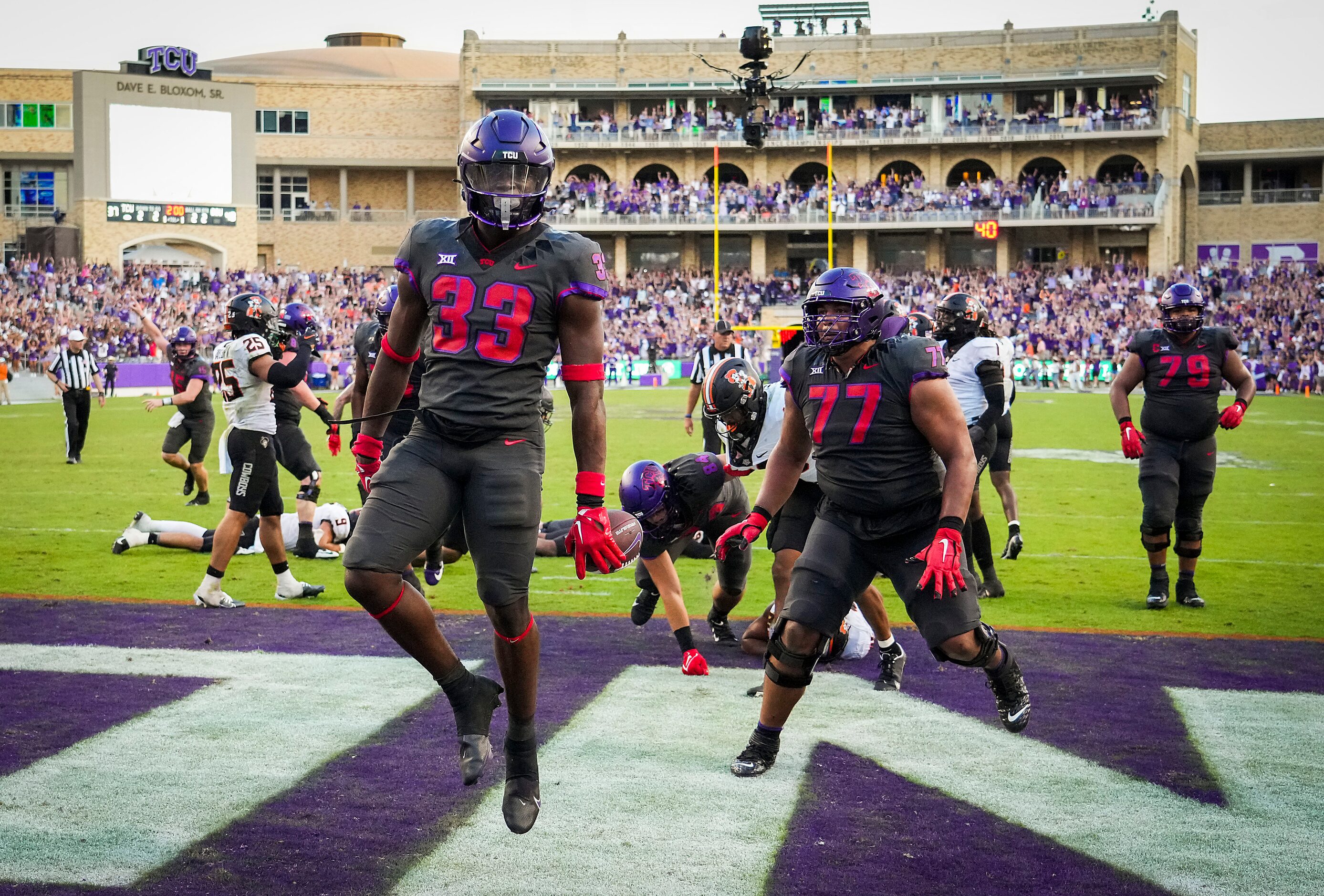 TCU running back Kendre Miller (33) celebrates after scoring on a game-winning 2-yard...