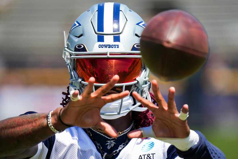 Dallas Cowboys wide receiver CeeDee Lamb catches a ball during a training camp practice on...
