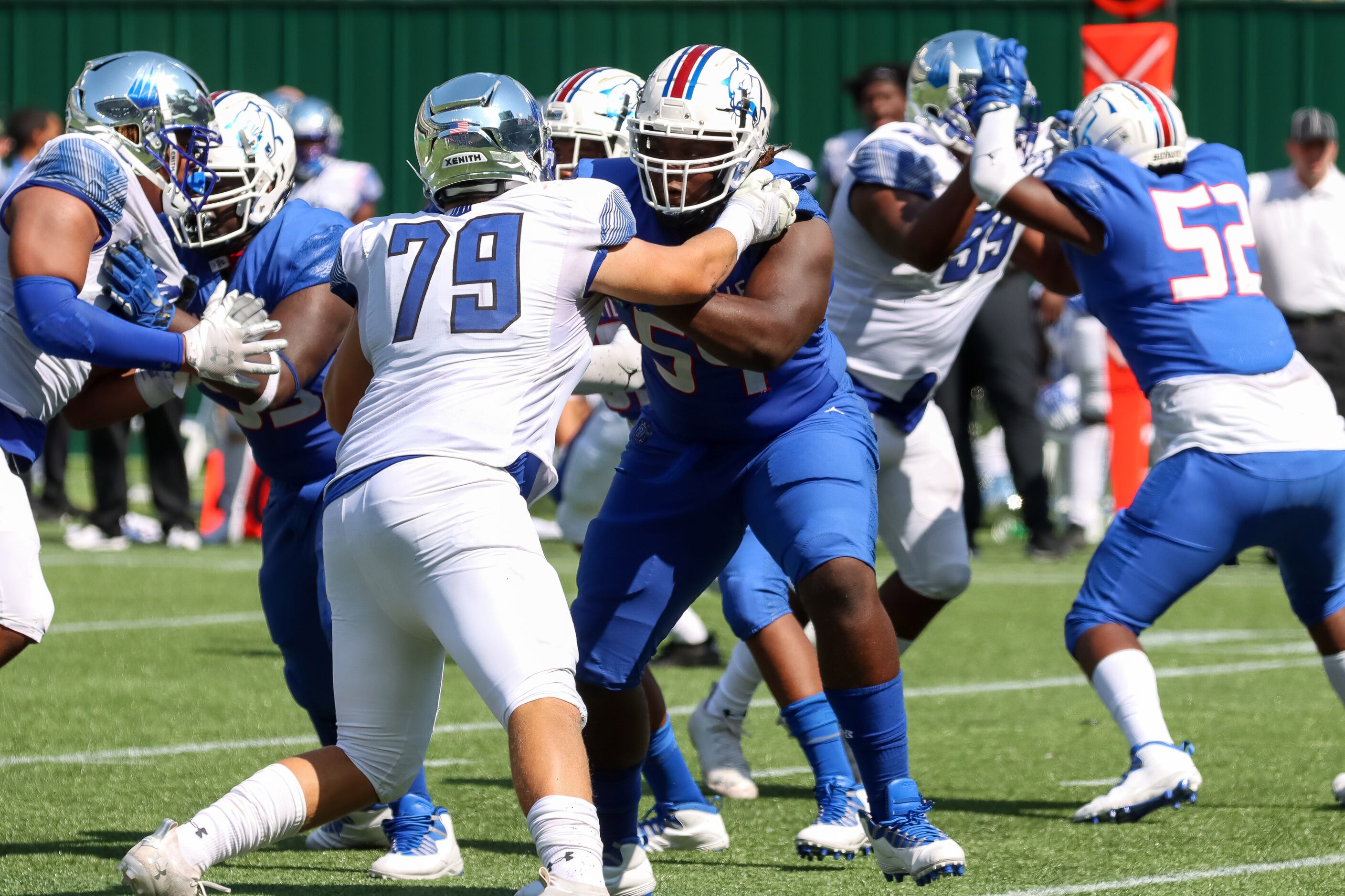 IMG Academy defensive lineman Liam McCormick (79) rushes Duncanville offensive lineman...