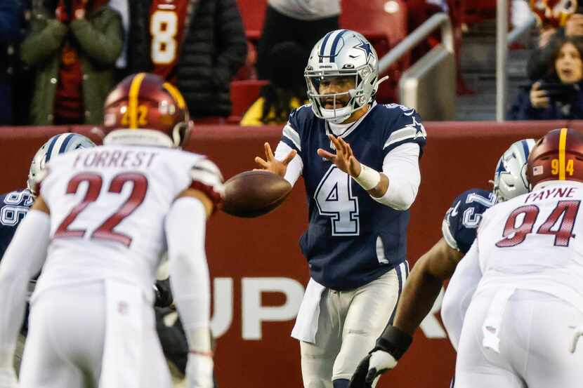Dallas Cowboys quarterback Dak Prescott (4) starts a play against Washington Commanders...