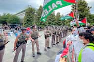 Texas State Troopers formed a line before pro-Palestinian demonstrators at the University of...