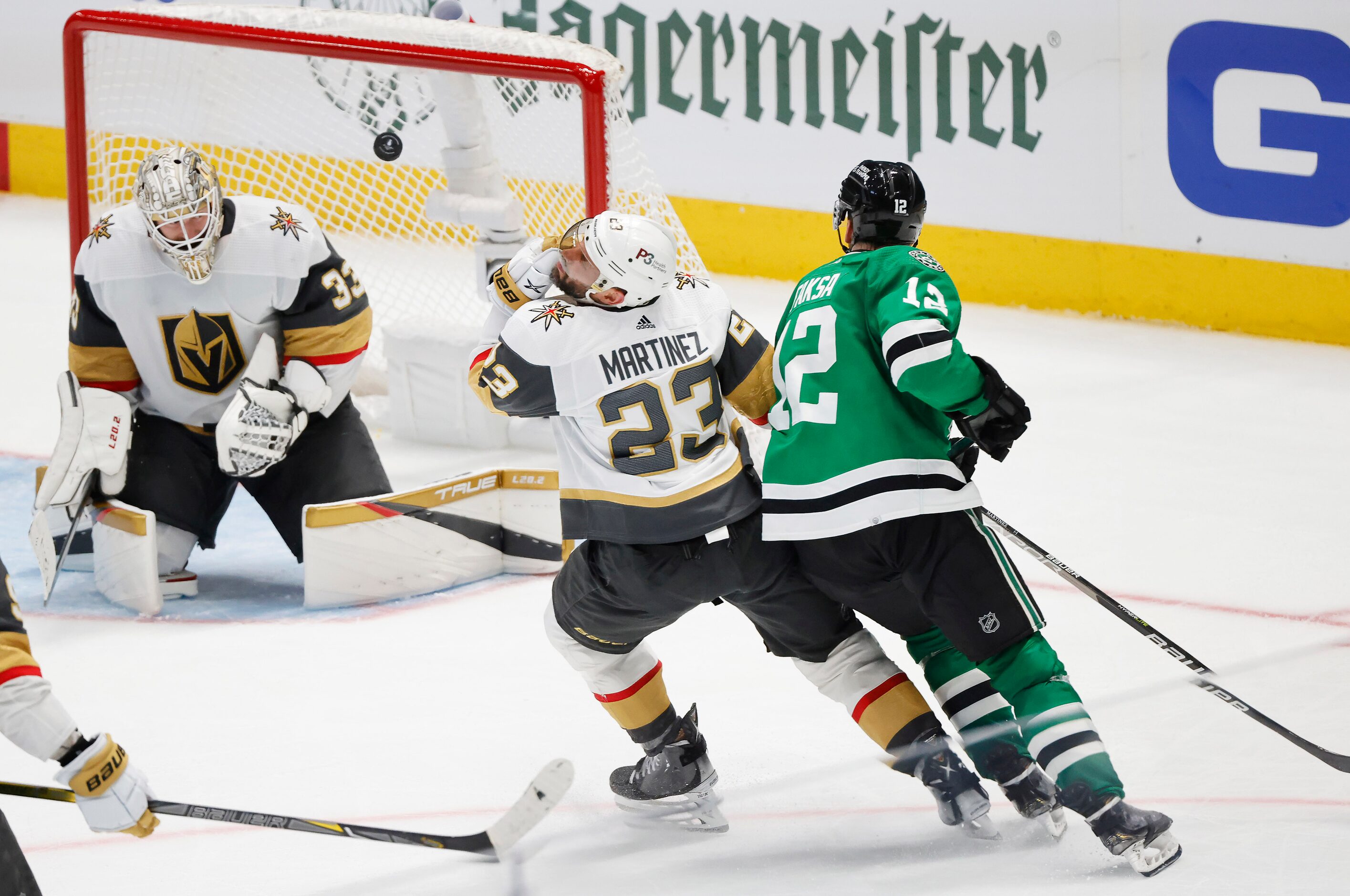 A shit by Dallas Stars center Radek Faksa (12) bounces off Vegas Golden Knights goaltender...