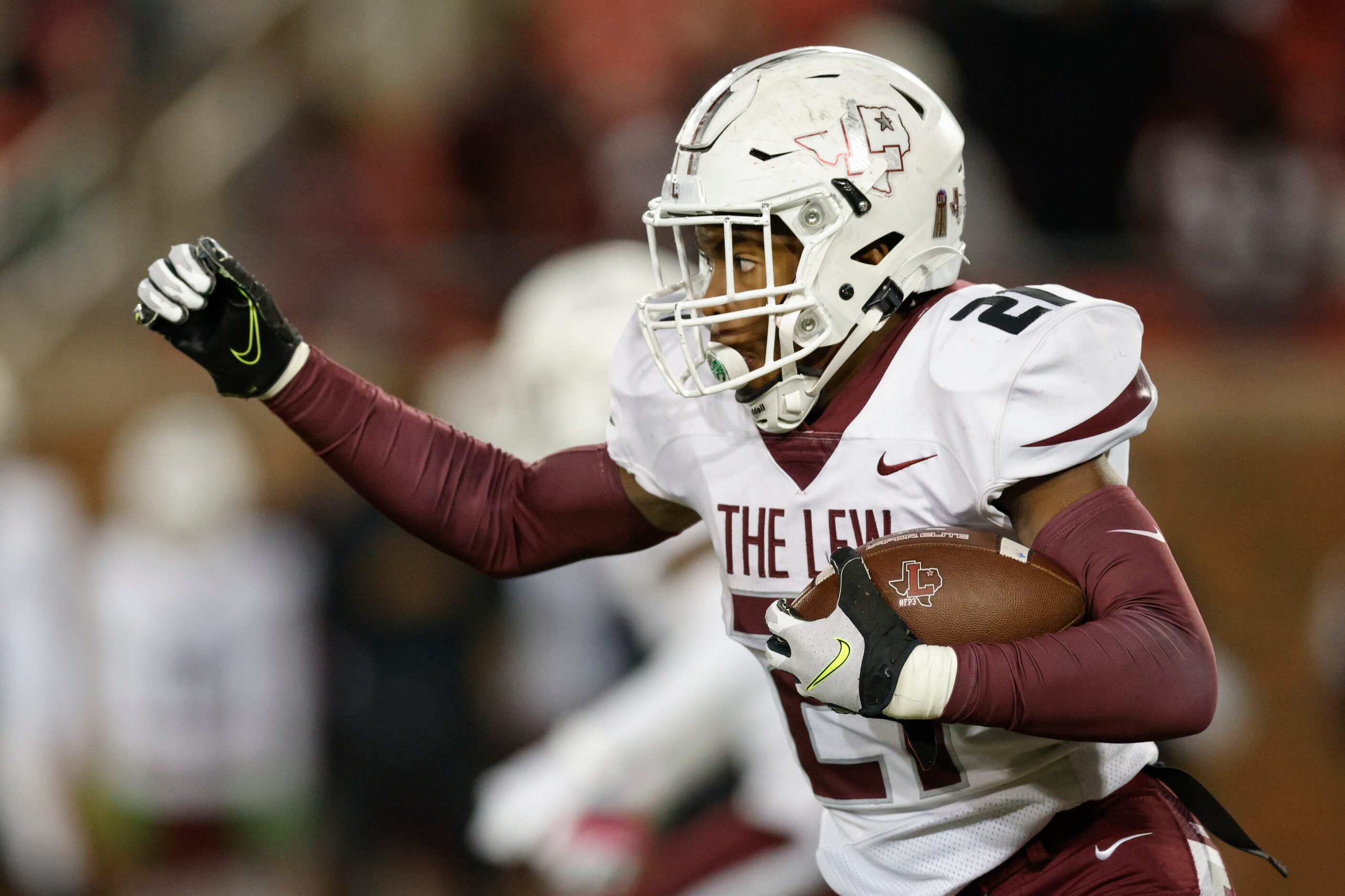 Lewisville running back Viron Ellison (21) runs the ball during the first half of a Class 6A...