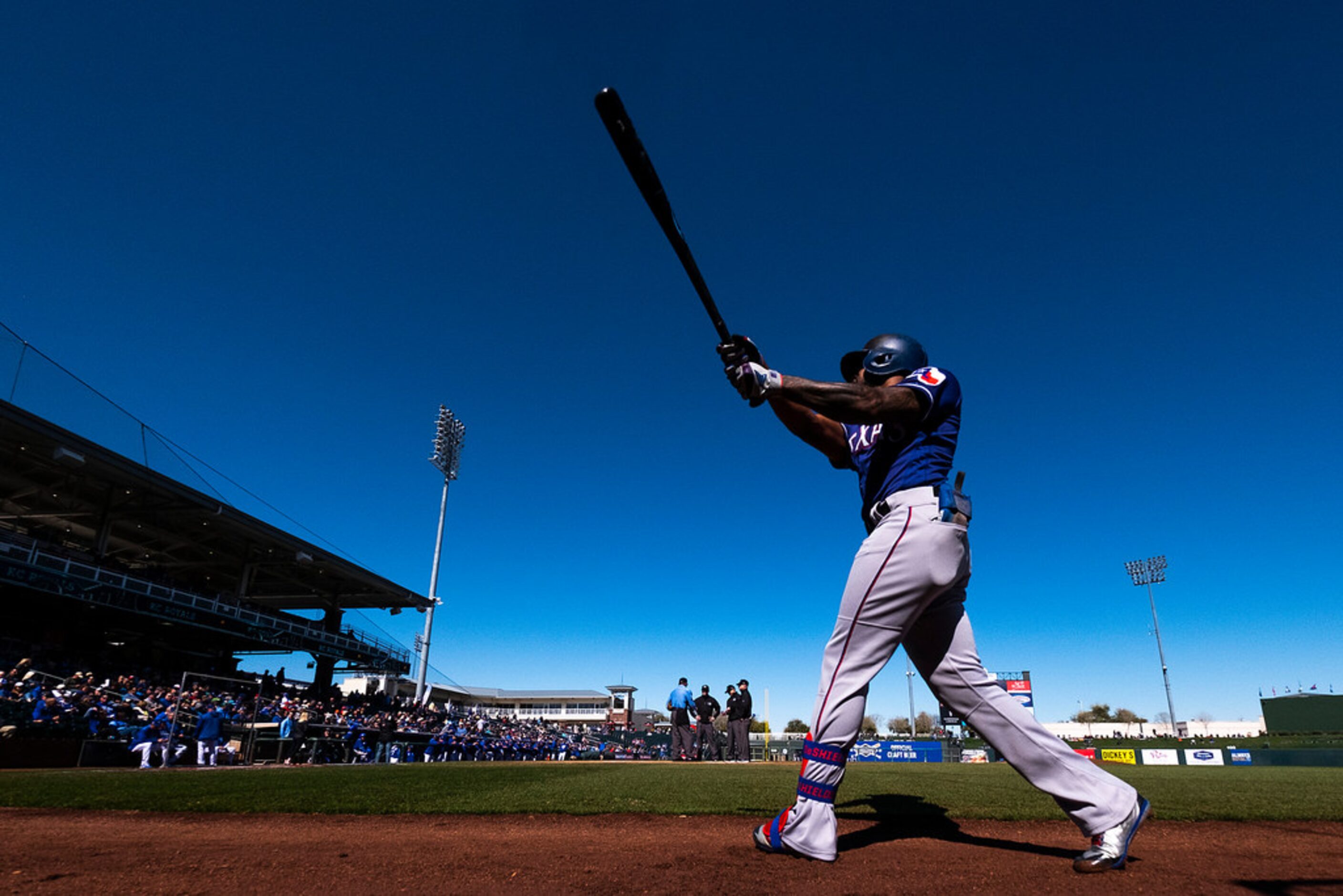 Texas Rangers outfielder Delino DeShields takes practice swings before leading off a spring...