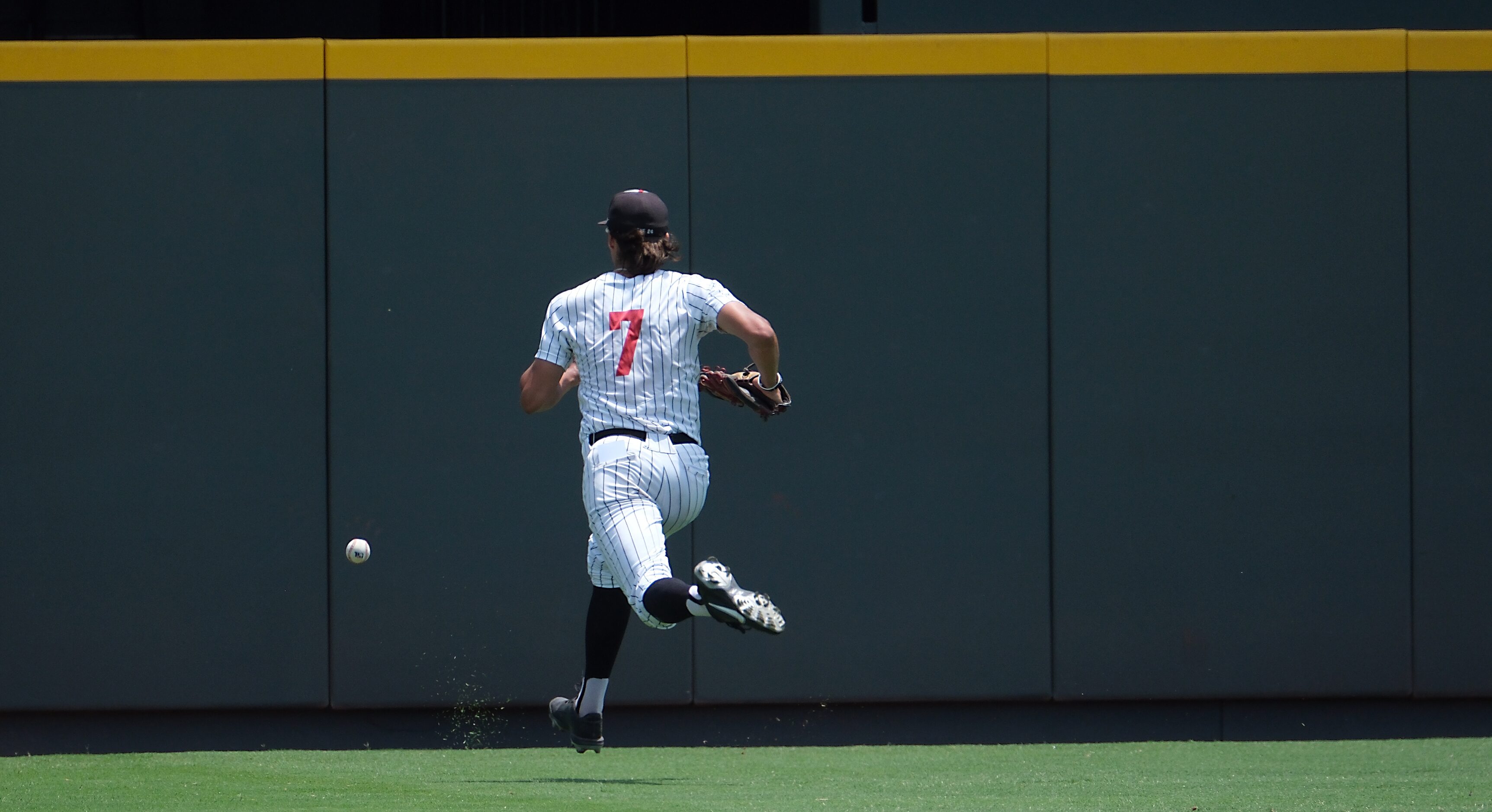 Argyle Park Prater, (7), chases down a deep ball hit to center field by Magnolia West during...