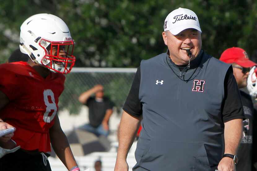 Rockwall-Heath football coach Rodney Webb oversees his team's spring workout session on May...