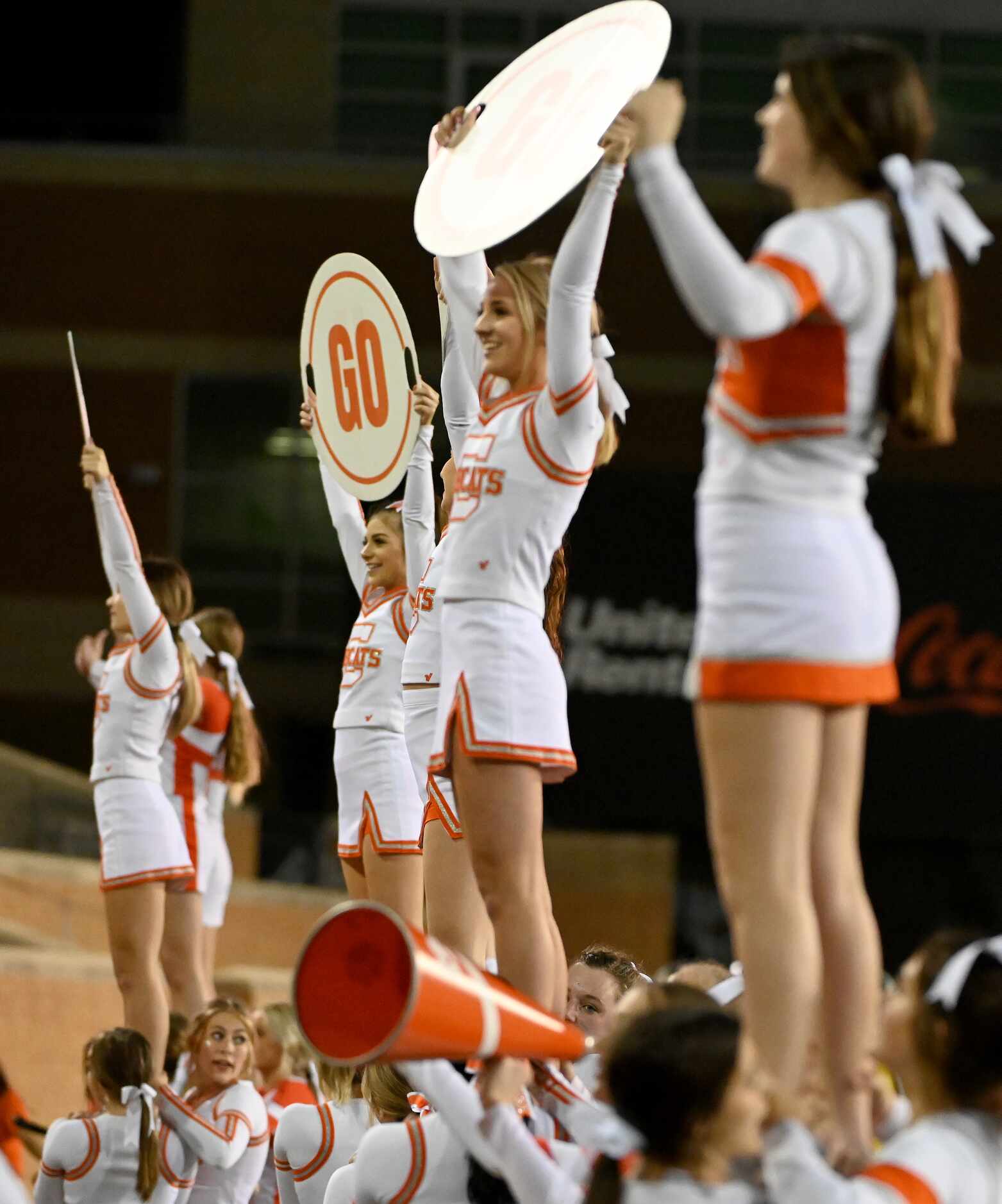 Celina's cheerleaders perform in the first half of a Class 4A Division II Region I final...