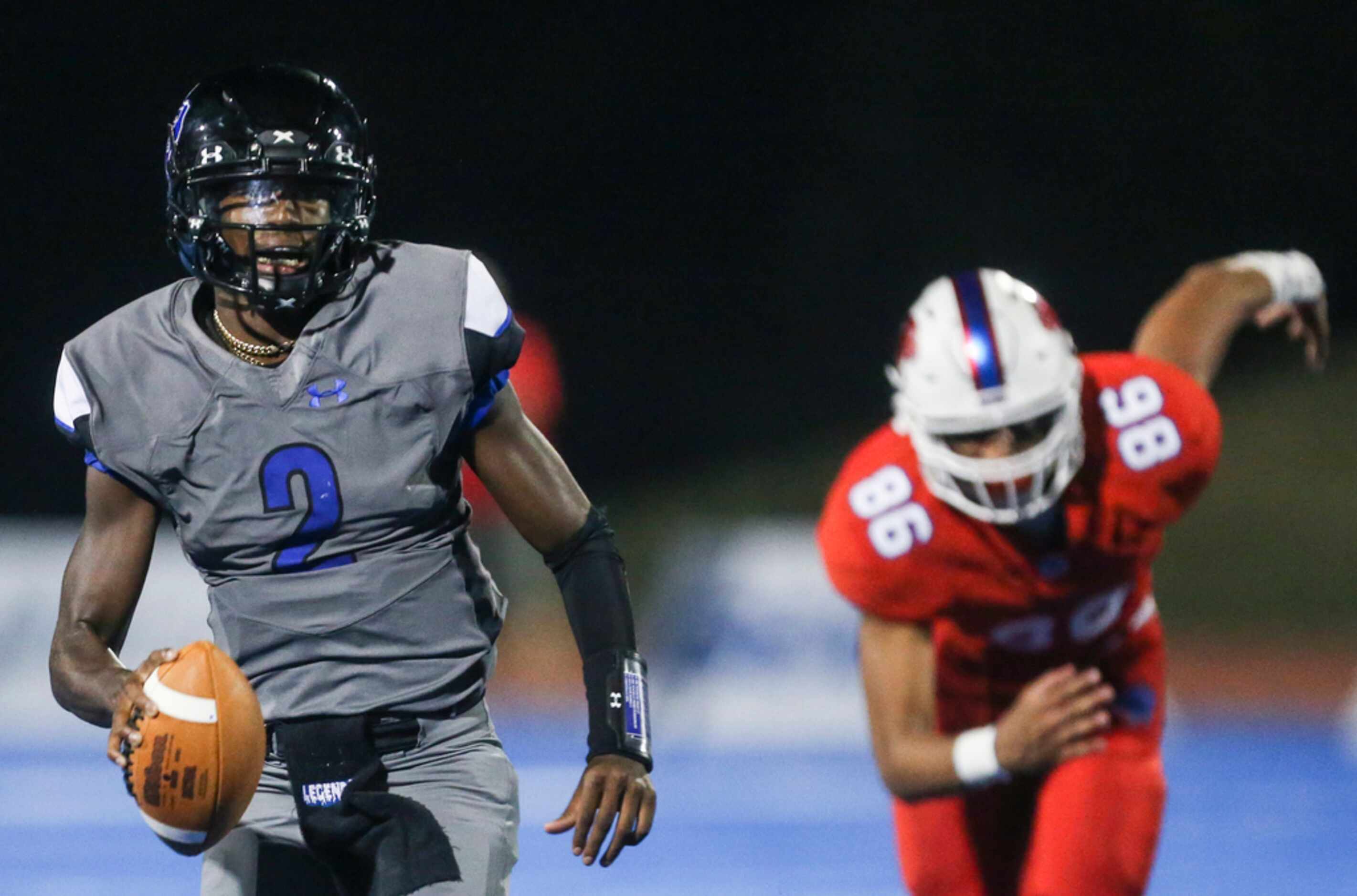 Trinity Christian-Cedar Hill quarterback Shedeur Sanders makes a break away from Parish...