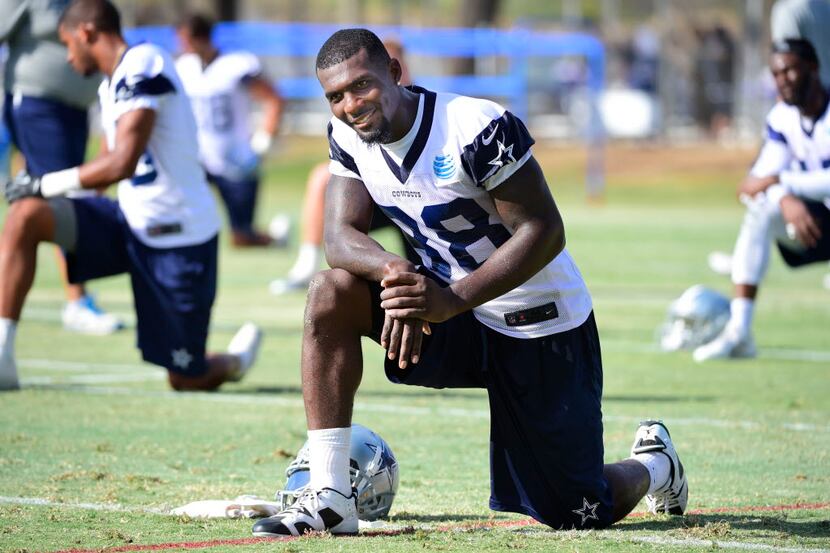 Dallas Cowboys receiver Dez Bryant smiles toward fans after their afternoon practice at...