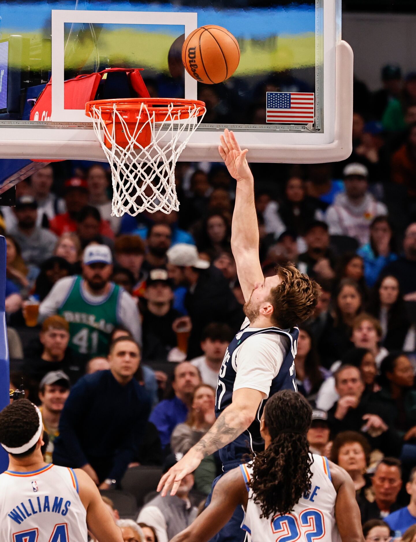 Dallas Mavericks guard Luka Dončić (77) goes for a layup against Oklahoma City Thunder...