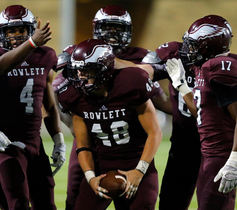 Rowlett linebacker Chase Taylor (48) celebrates his fumble recovery against Plano in the...