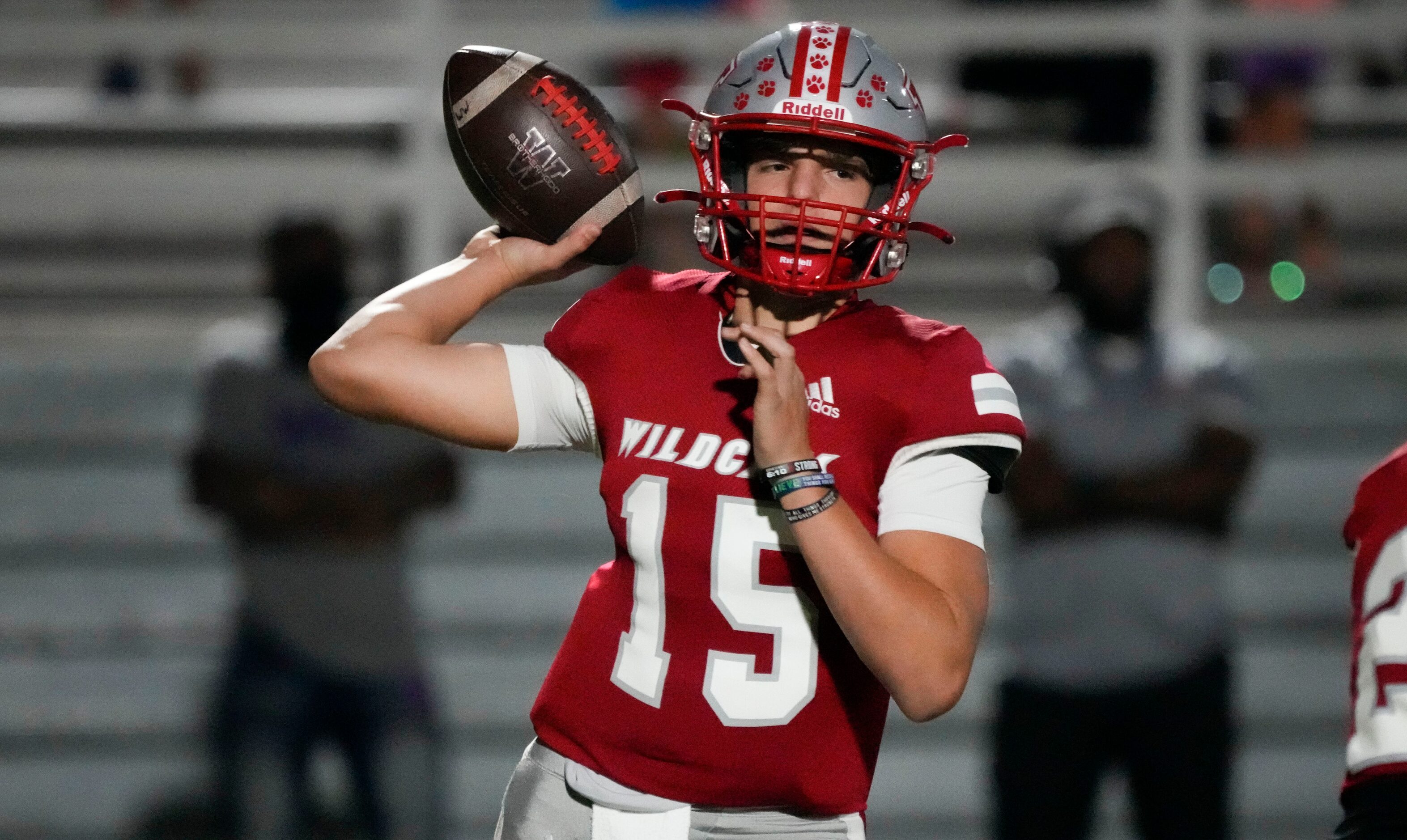 Woodrow Wilson sophomore quarterback Cam McGuire (15) throws during the first half of a high...