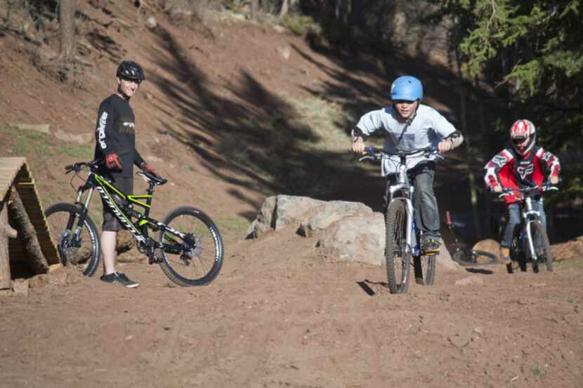 Mountain bikers ride trails at Angel Fire Resort in New Mexico. The park's 50 miles of...