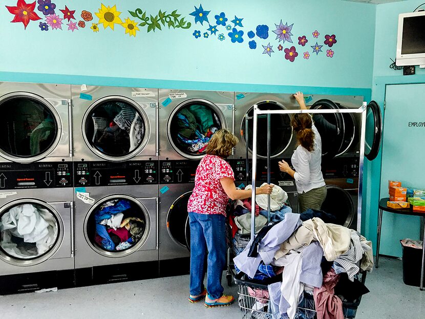  Volunteers do laundry for Wimberley flood victims on Wednesday, May 27, 2015 at Wash Day...