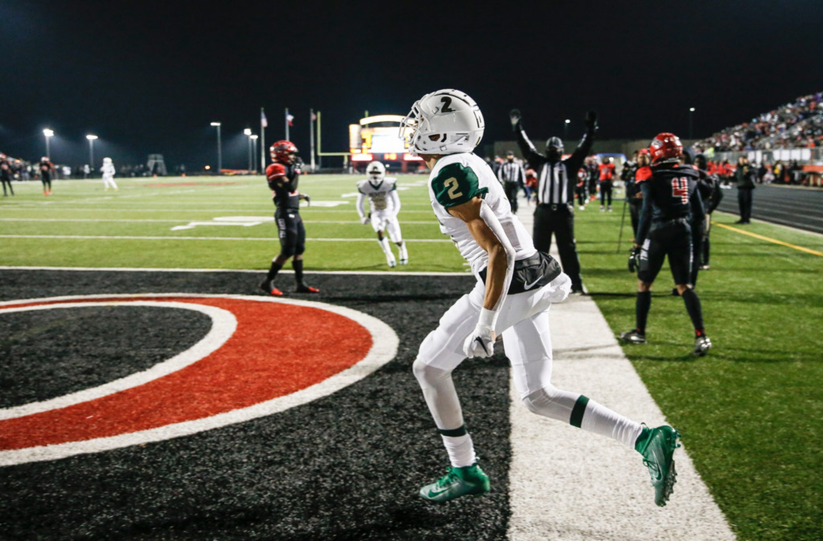 DeSoto wide receiver Lawrence Arnold (2) celebrates scoring during a high school football...