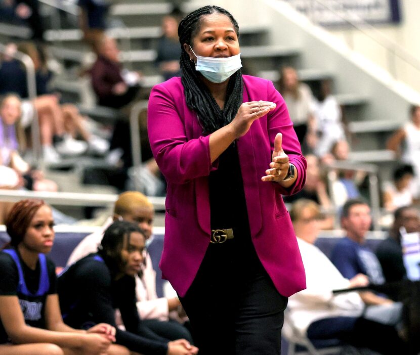 Hebron head coach Lisa Branch tries to signal a play against Flower Mound on January 10,...