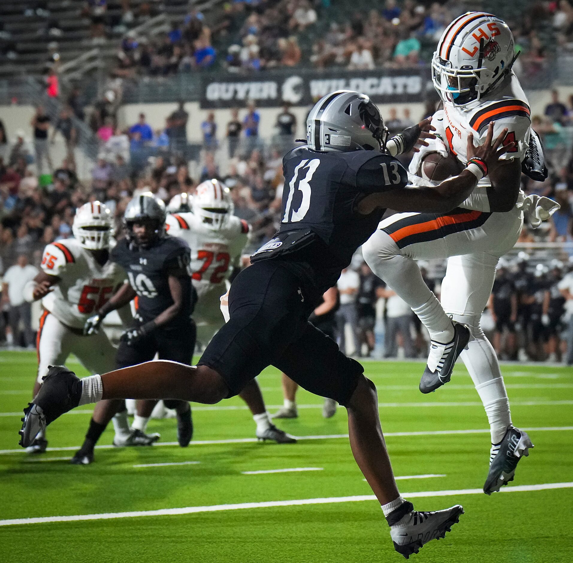 Lancaster wide receiver Dwight Jones (4) catches a touchdown pass as Denton Guyer defensive...