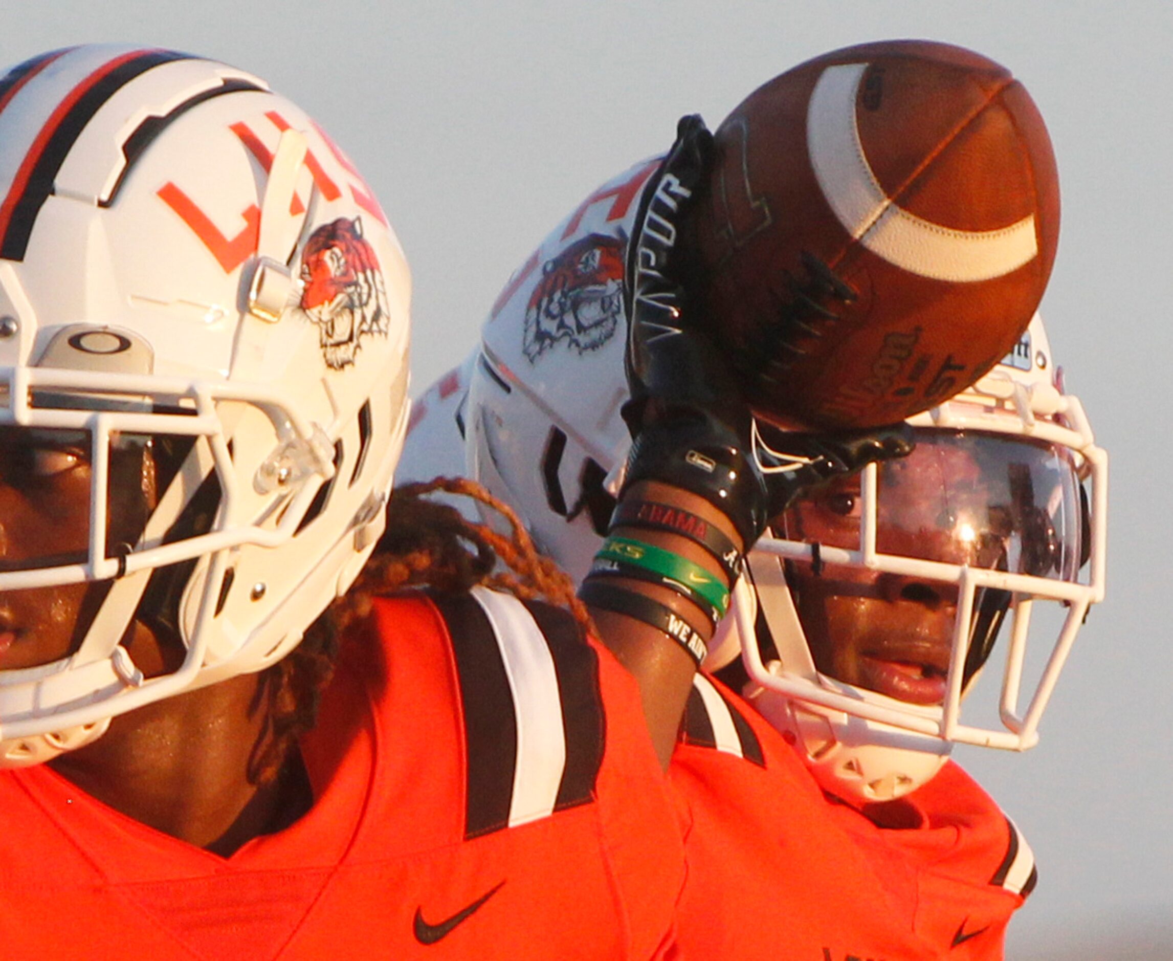 Lancaster running back Kewan Lacy (2) returns the ball to a game official following a first...