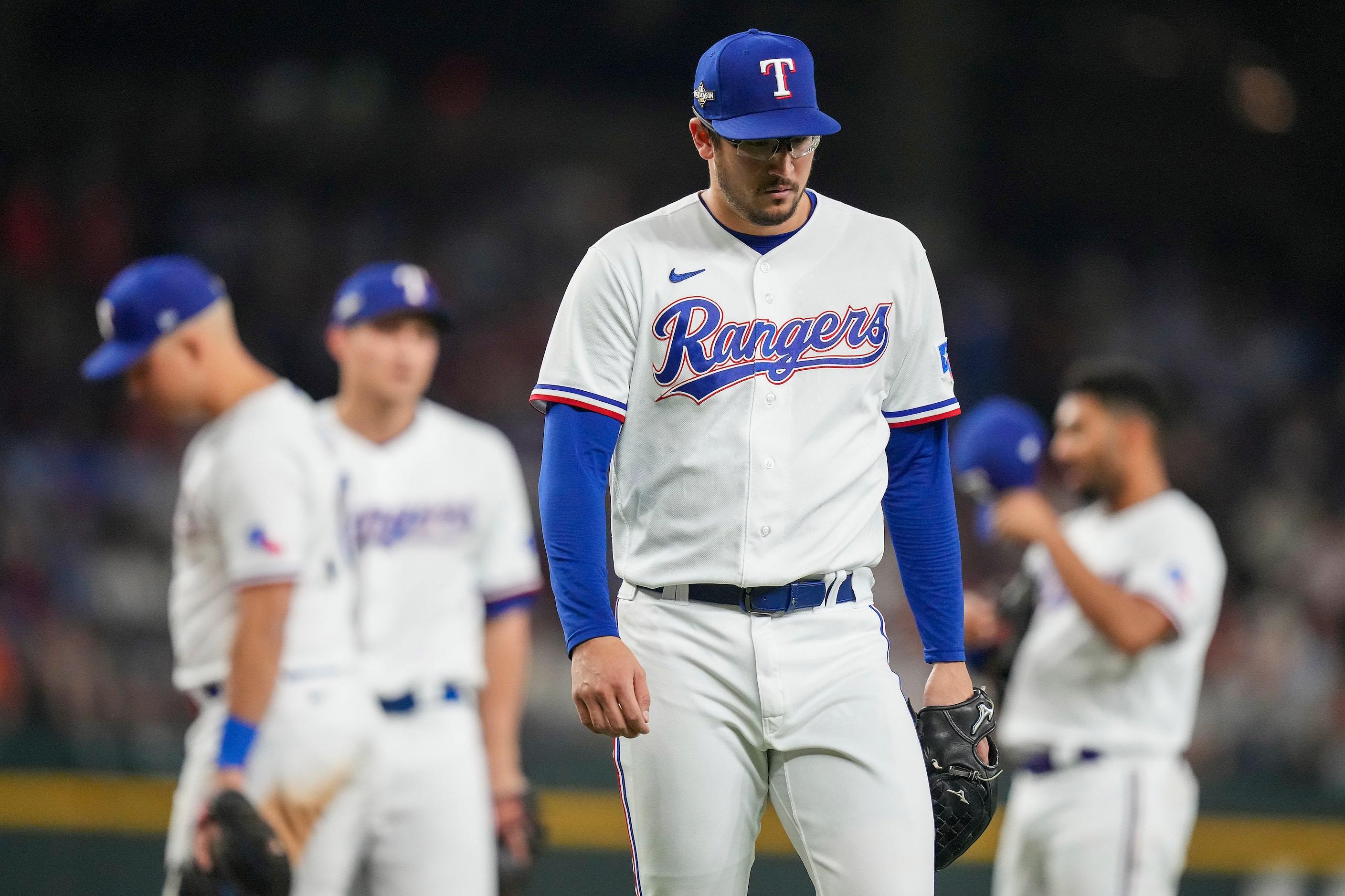 Texas Rangers starting pitcher Dane Dunning (33) is pulled in the fourth inning of play...