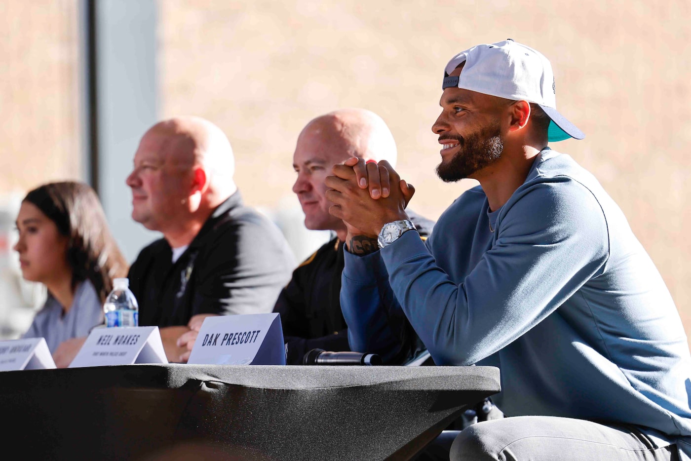 Founder of Faith Fight Finish and Dallas Cowboys Quarterback Dak Prescott laughs as he...