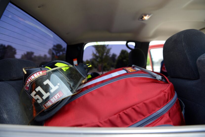 McKinney firefighter/paramedics Chris Roberts and Brian Roether stand next to the truck they...