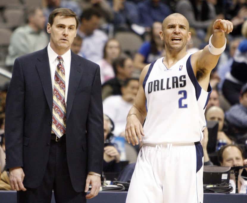 Dallas Mavericks head coach Rick Carlisle and Jason Kidd (2) during a break in play in a...