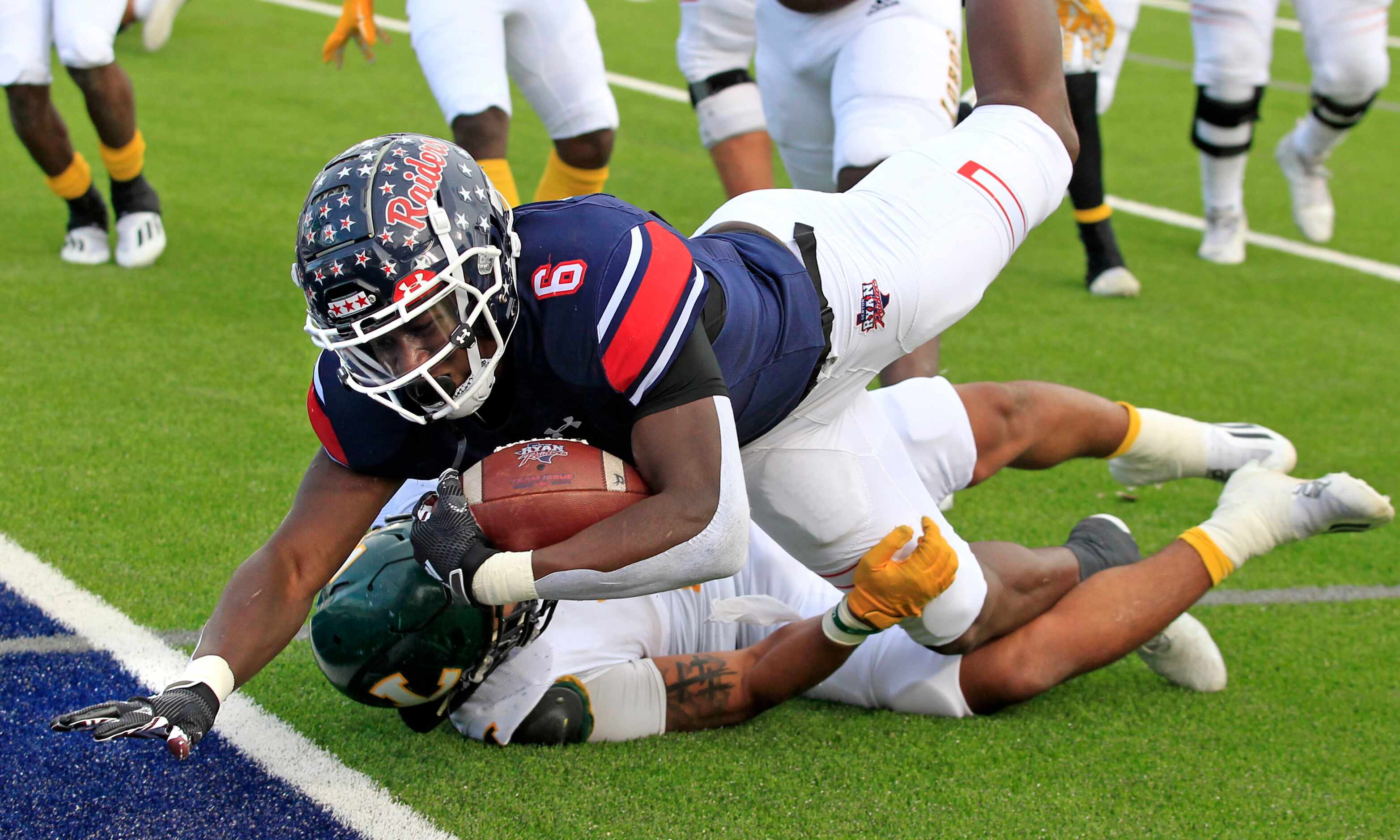 Denton Ryan RB Anthony Hill Jr. (6) runs over a Longview defender in route to a touchdown...