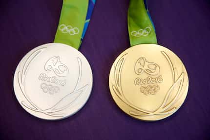 Olympic gymnast Madison Kocian brought the gold and silver medals to a press conference at...