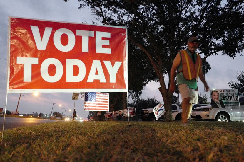 A voting sign stands during the first day of early voting at Lark Library on Monday, Oct. 24...