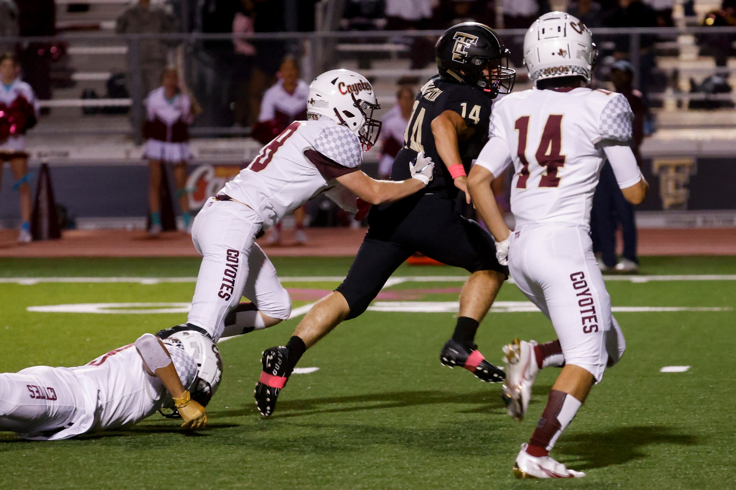 The Colony’s running back Caden Chaulk (14) evades the Frisco Heritage defense for a long...