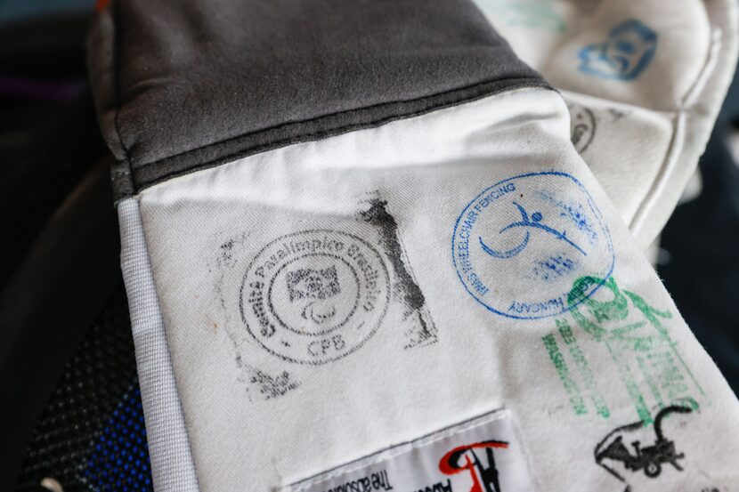 Nico Badeaux' parafencing glove shows some stamps from international competitions in which...