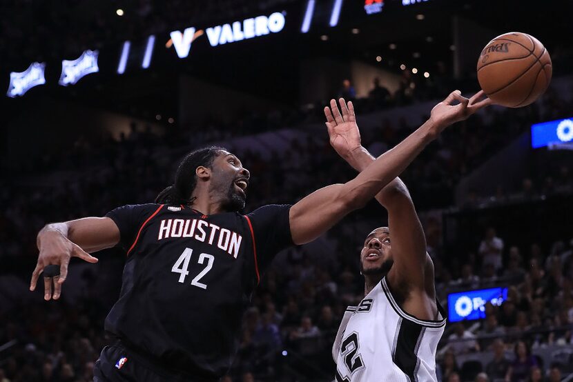 SAN ANTONIO, TX - MAY 03:  Nene Hilario #42 of the Houston Rockets drives against LaMarcus...