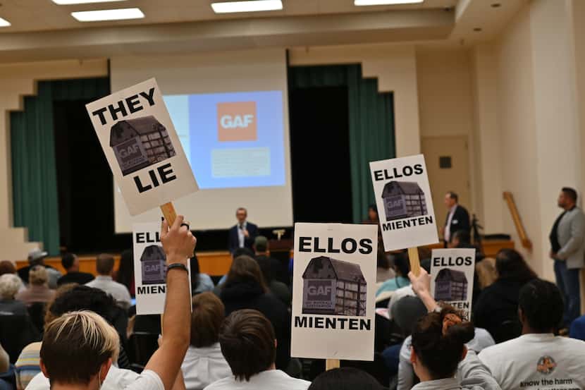 West Dallas neighbors protest the shingle manufacturer GAF at the company's first community...
