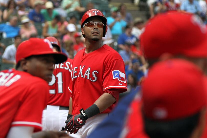 Texas Rangers right fielder Nelson Cruz (17) heads back to the dugout after his long foul...