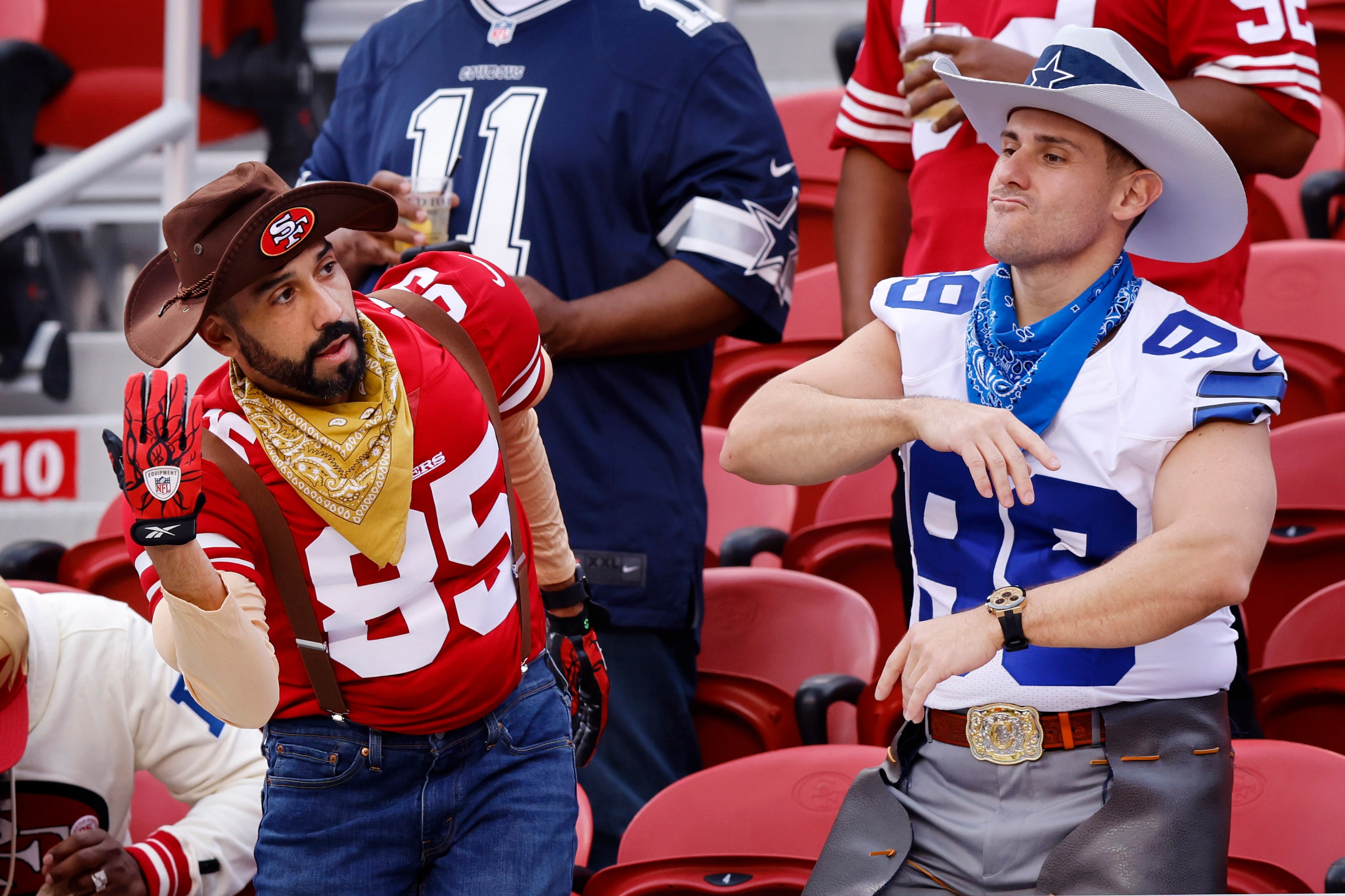 A San Francisco 49ers and Dallas Cowboys fans dressed the part as they entrained those...