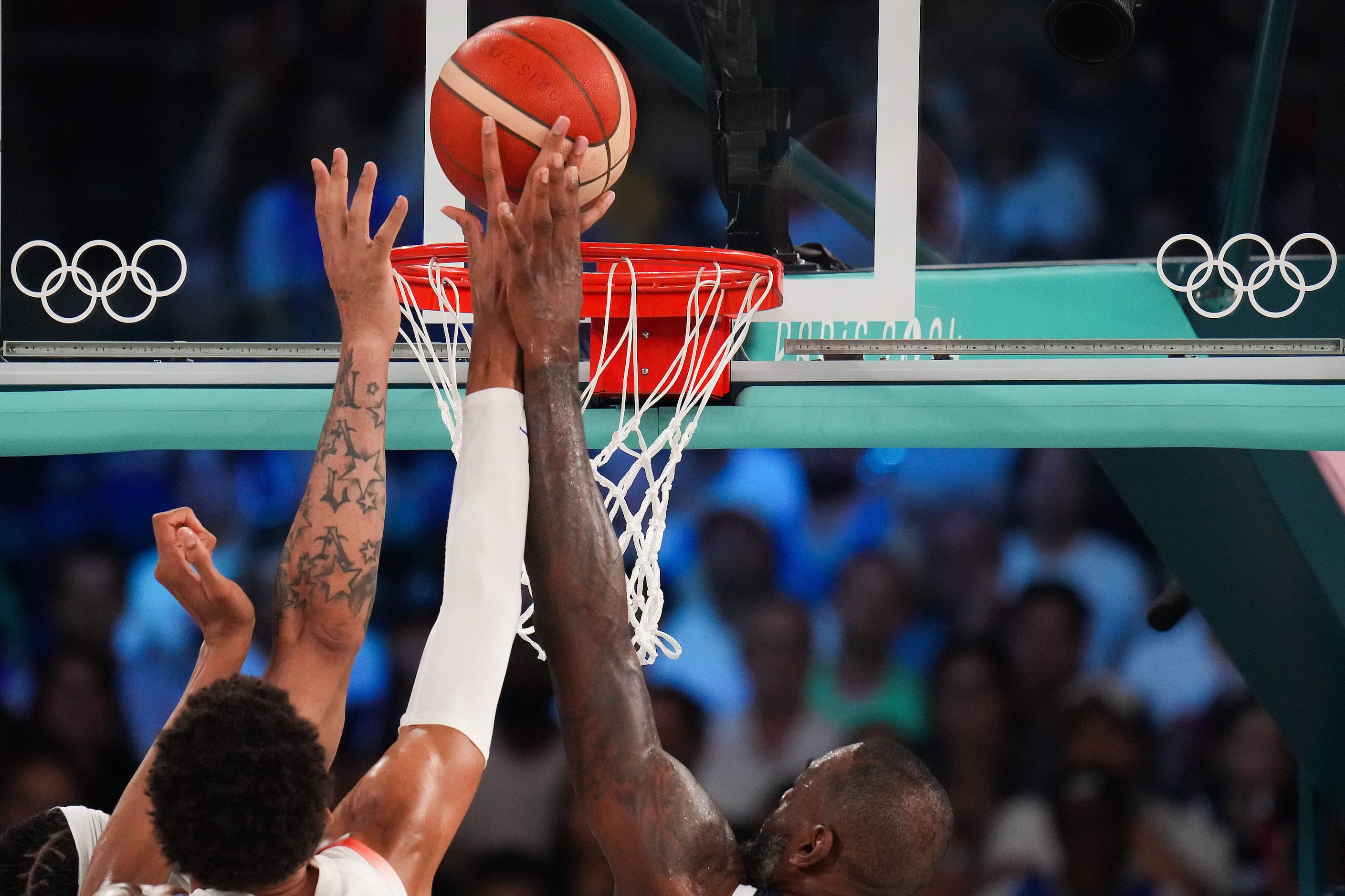 Victor Wembanyama (32) of France scores past Lebron James (6) of the United States during...