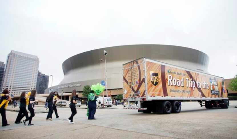 
A parade marched outside New Orleans’ superdome in 2012 as an 18-wheeler carried the wooden...