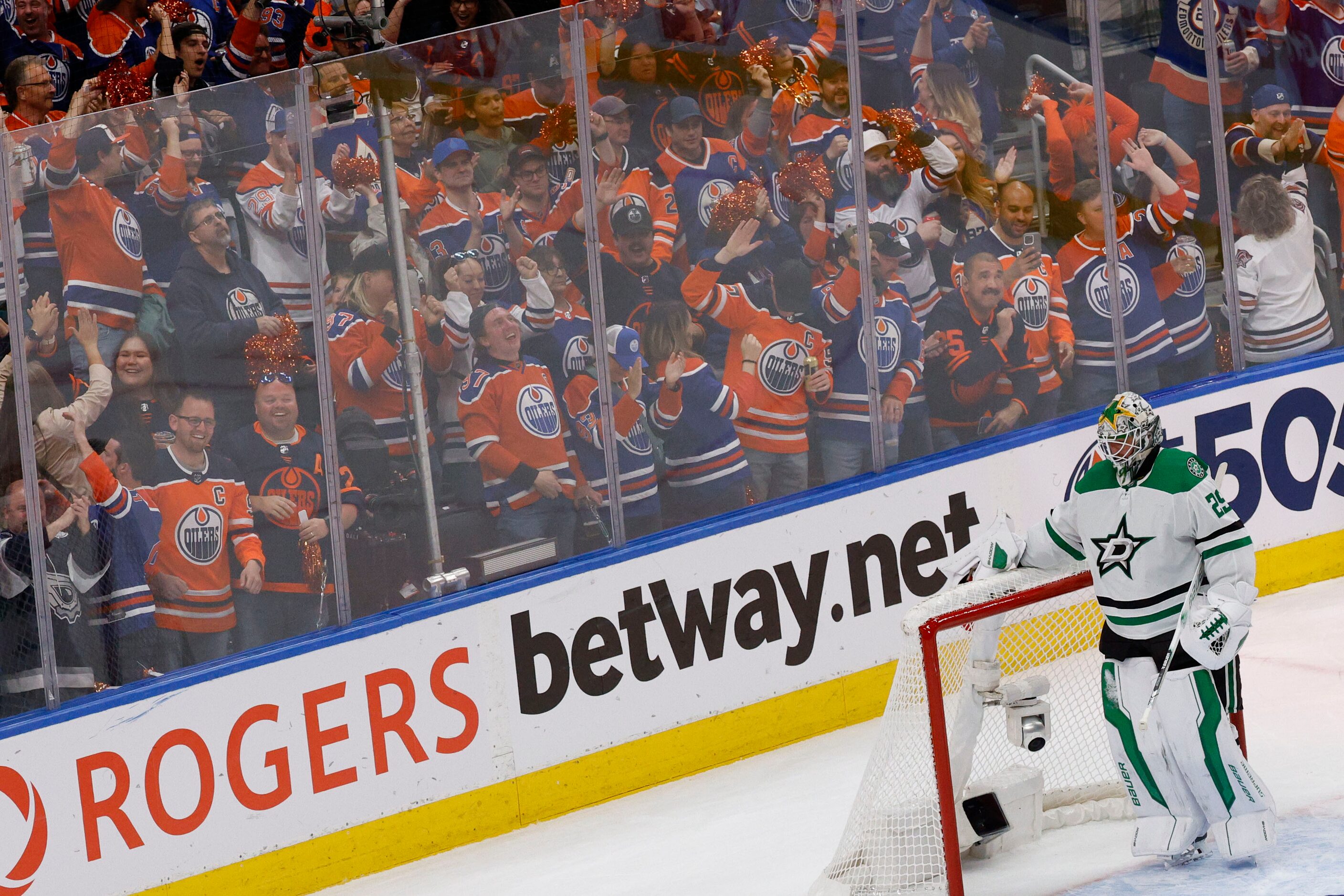 Dallas Stars goaltender Jake Oettinger (29) looks down as fan celebrate after Edmonton...