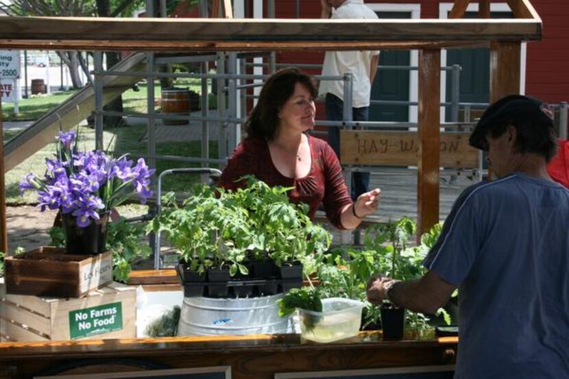 
Kari Gates, left, opened up the Collin County Farmers Market last spring for its first...