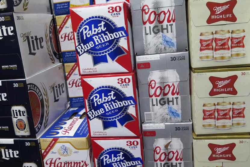 In this photo taken on Thursday, Nov. 8, 2018, cases of Pabst Blue Ribbon and Coors Light...