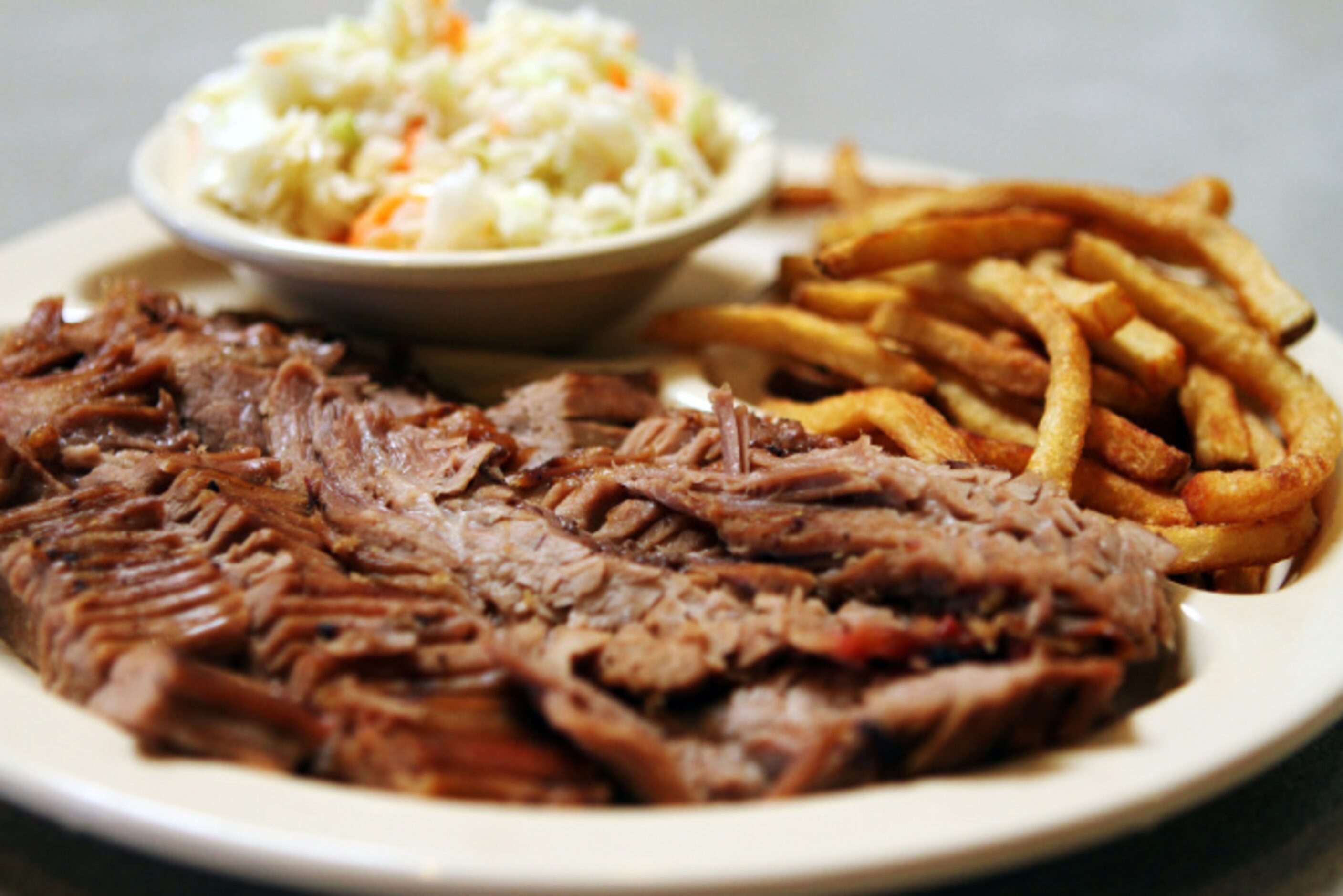 Back Country Bar-B-Q's brisket plate with top fat, cole slaw and fries, in Dallas