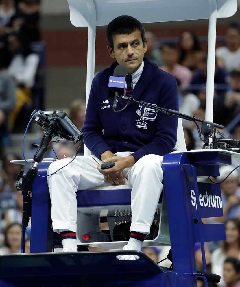 Carlos Ramos (AP Photo/Julio Cortez)