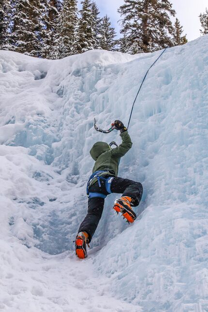 Reid Irwin, 11, climbs a frozen waterfall in Johnston Canyon.