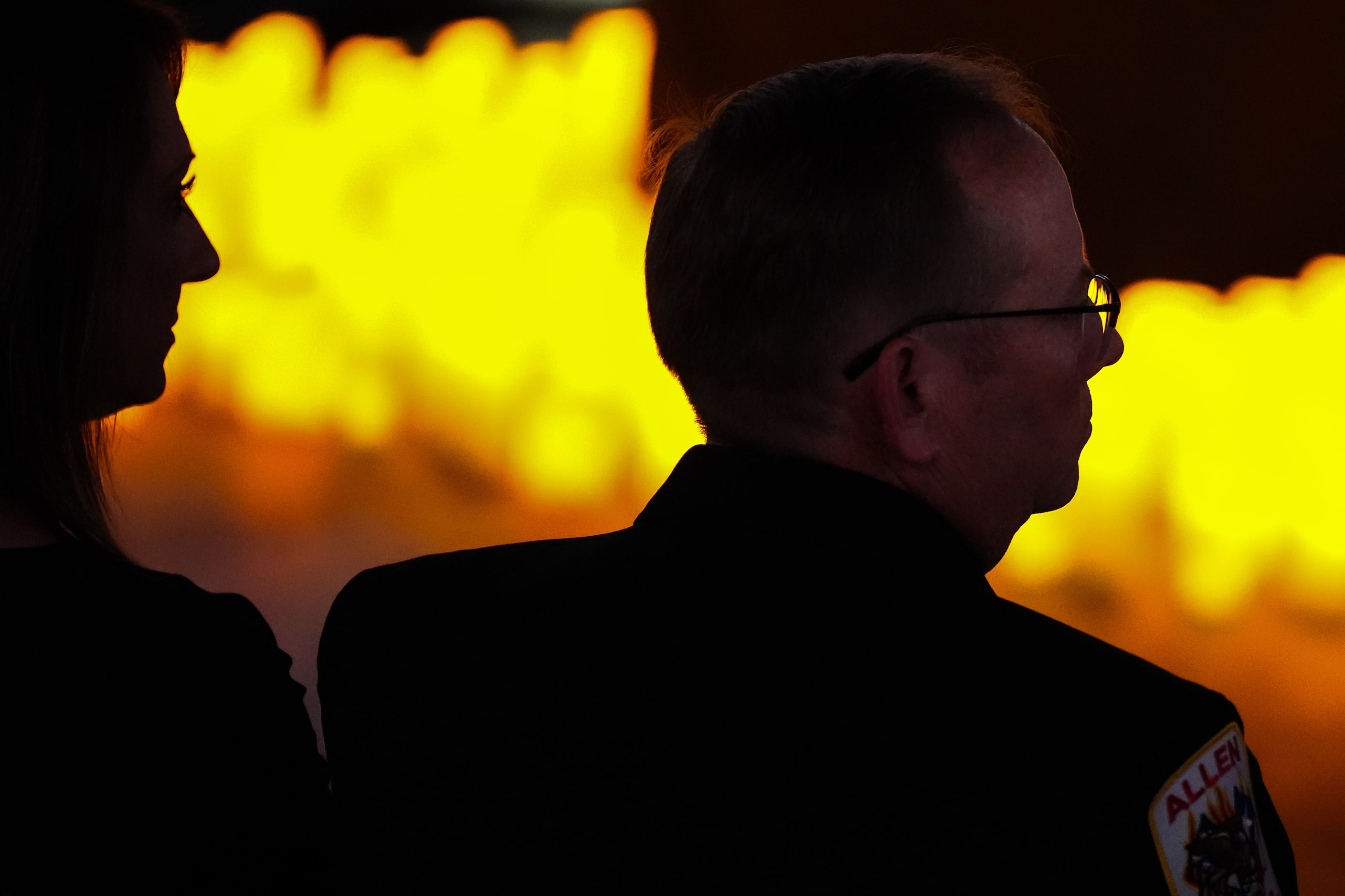 Fire Chief Jonathan Boyd listens as the Allen High School Varsity Men’s Chior sings “Amazing...