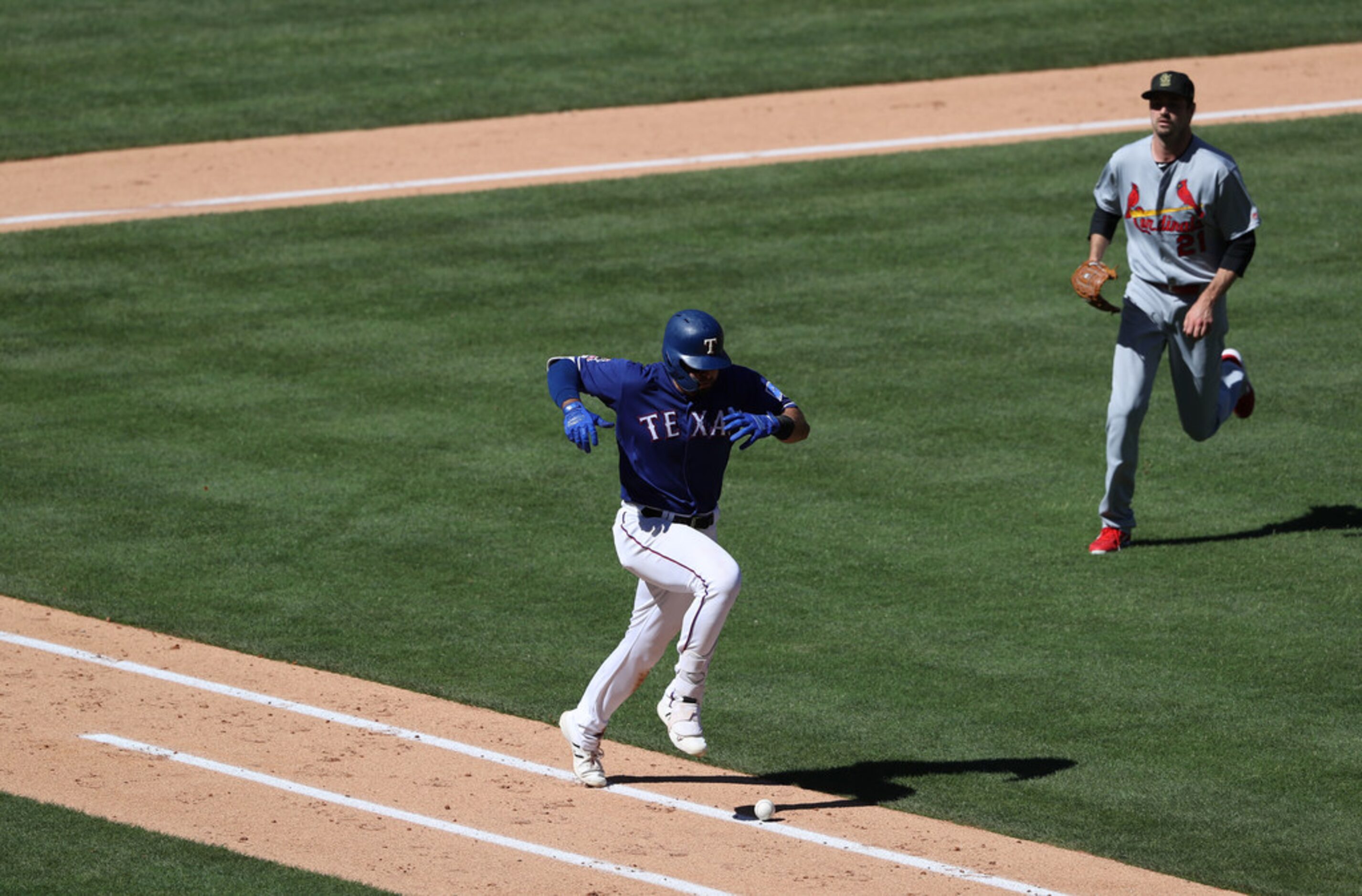 ARLINGTON, TEXAS - MAY 19:  Joey Gallo #13 of the Texas Rangers hits a single against Andrew...