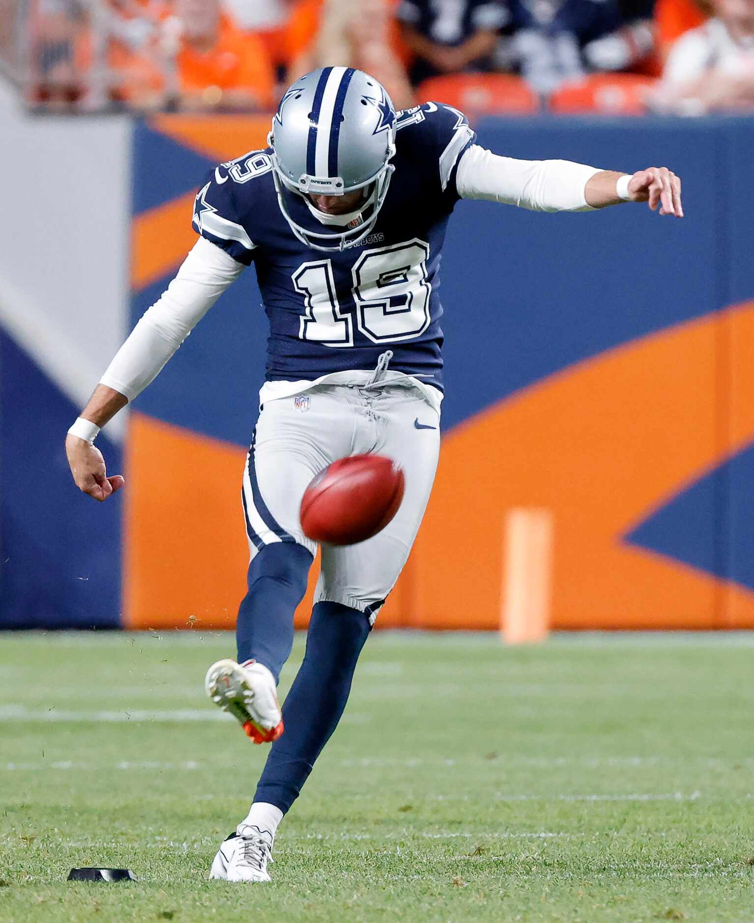 Dallas Cowboys place kicker Brett Maher (19) kicks off to the Denver Broncos during the...