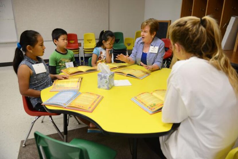 
Pat Warren speaks to students (from left) Isha Rai, Oo Reh and Ei Meh during the Vickery...