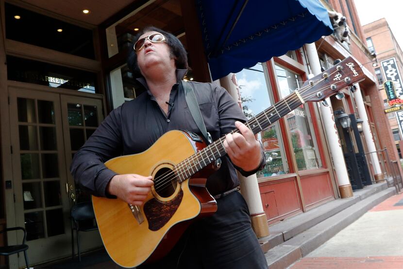 Phil Sneed makes his living street performing by Wild Bill's Western Store in the West End...