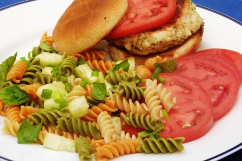 
Chicken Burgers and a pasta salad add up to a casual meal with a hint of Italy. 
